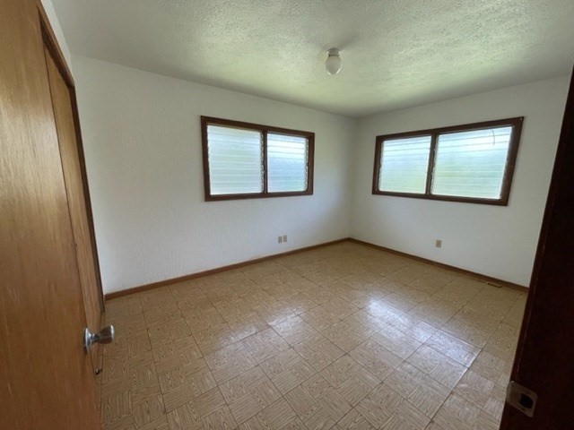 178 Eggerking Road Kapaa, HI 96746 - Photo 6 of 9 an empty room with windows