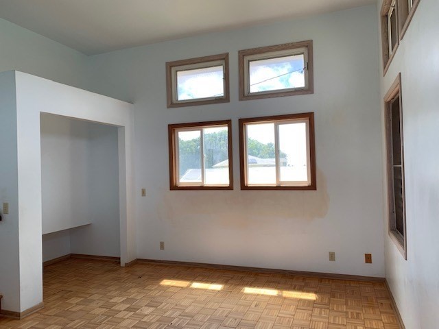178 Eggerking Road Kapaa, HI 96746 - Photo 8 of 9 a view of an empty room with wooden floor and a window