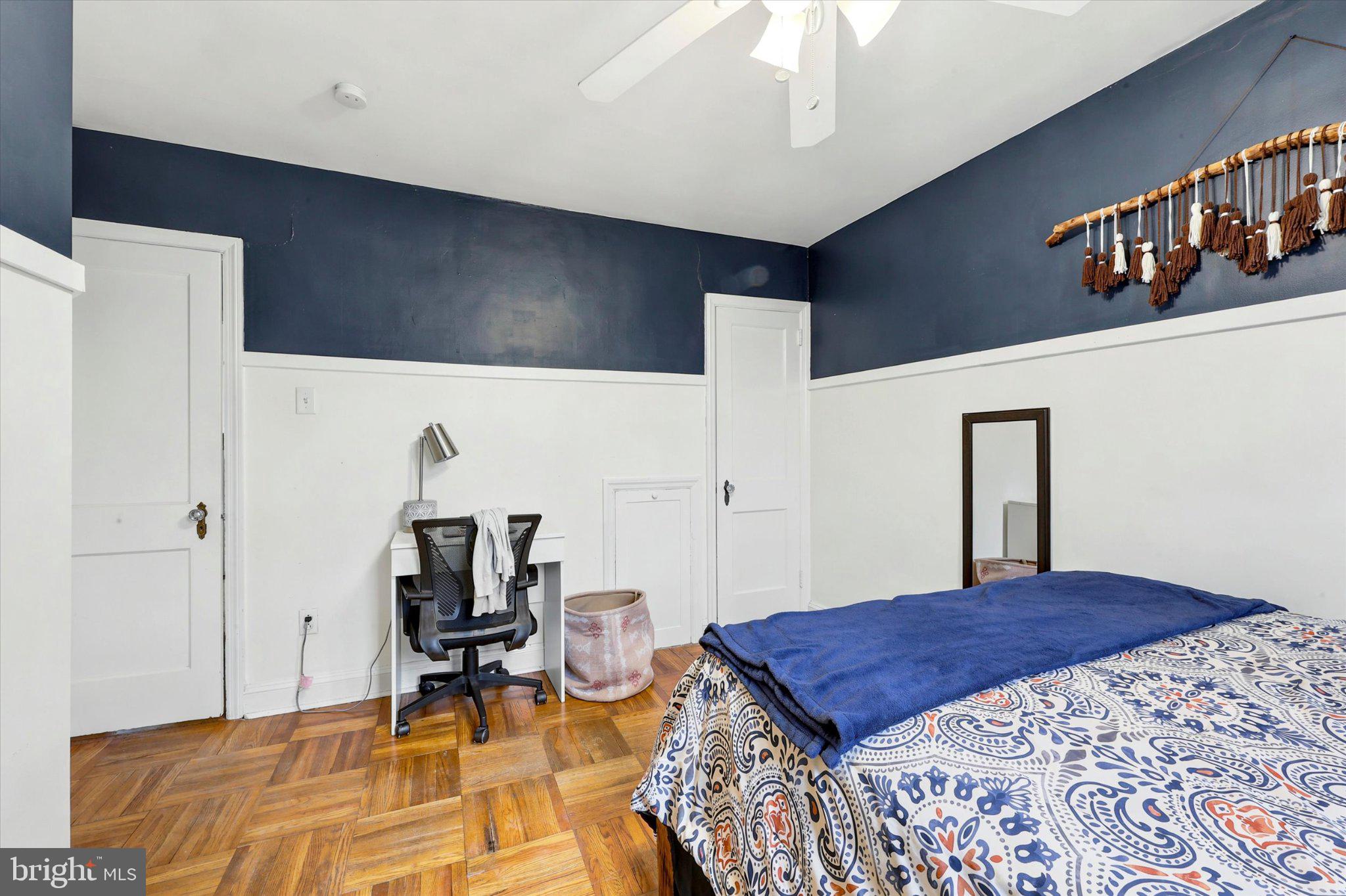 115 Academy Lane Upper Darby, PA 19082 - Photo 18 of 25 a bedroom with a bed and a table in it