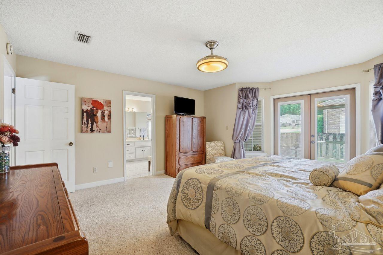 1437 Kings Road Cantonment, FL 32533 - Photo 25 of 67 a bedroom with a bed and a window