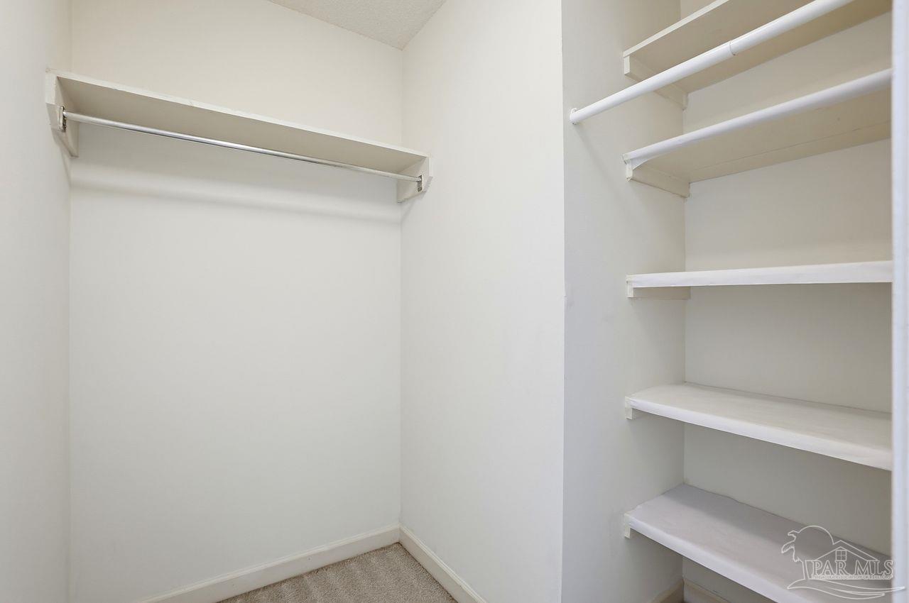 1437 Kings Road Cantonment, FL 32533 - Photo 32 of 67 a view of an empty walk in closet