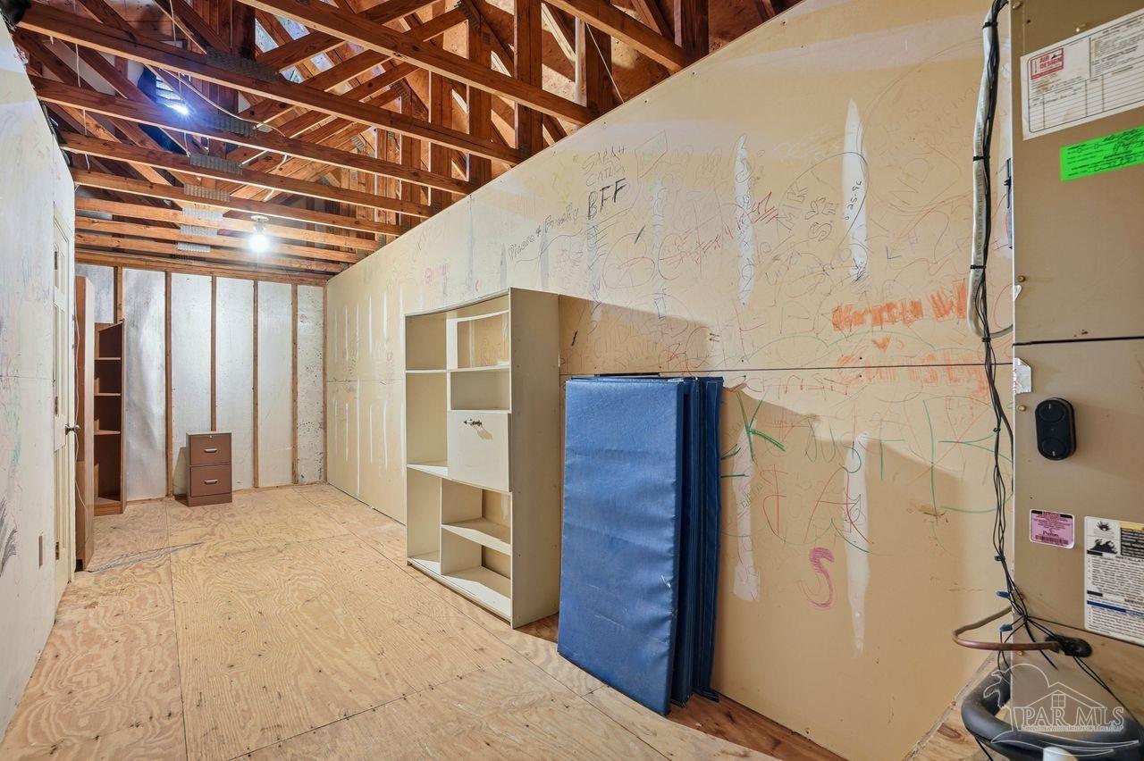 1437 Kings Road Cantonment, FL 32533 - Photo 51 of 67 Attic Storage through upstairs bedroom closet.
