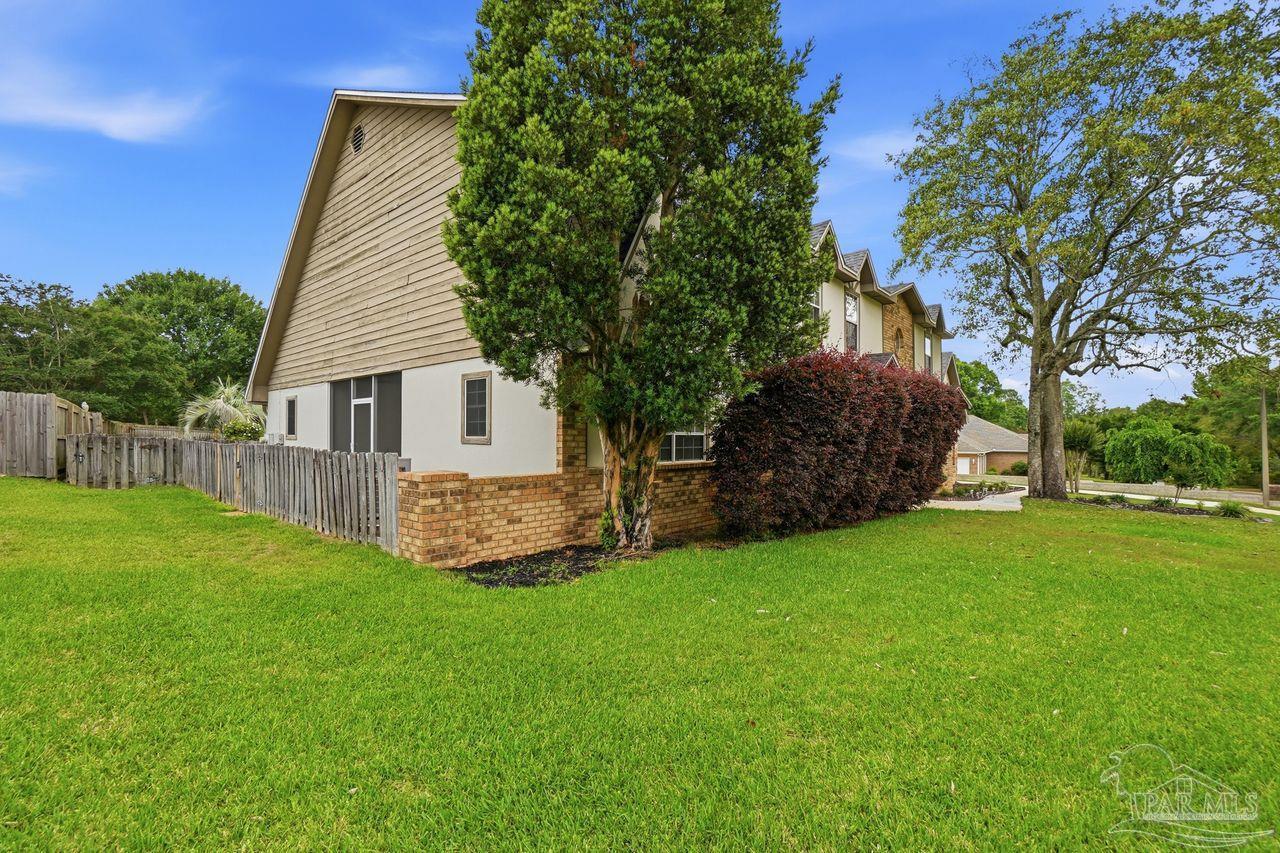 1437 Kings Road Cantonment, FL 32533 - Photo 54 of 67 a view of a house with a yard