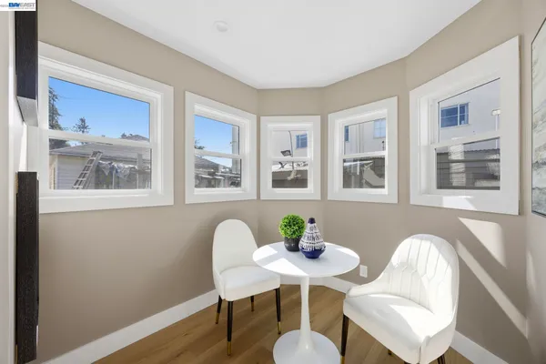 a view of a dining room with furniture window and wooden floor