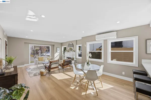 a living room with furniture window and wooden floor