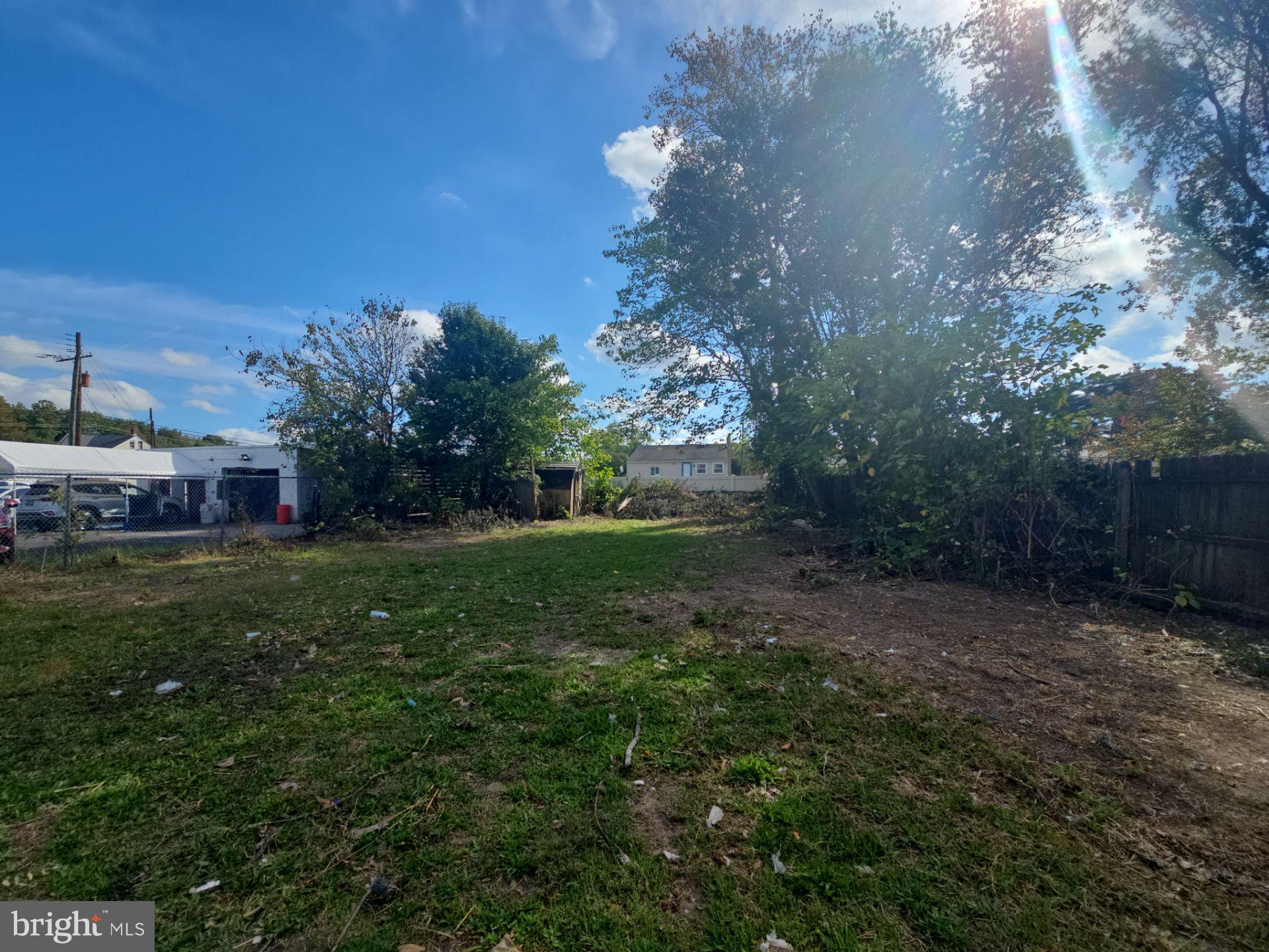 99 North Virginia Avenue Carneys Point, NJ 08069 - Photo 3 of 19 a view of a yard with an tree