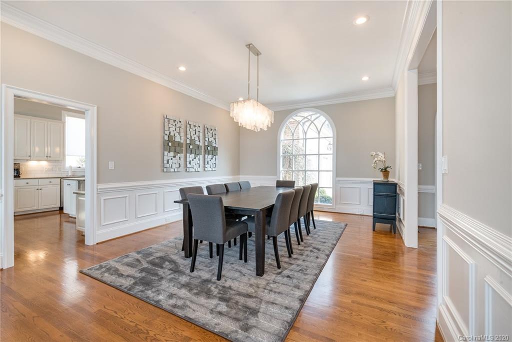 16133 North Point Road Huntersville, NC 28078 - Photo 11 of 42 a view of a a dining room with furniture window and wooden floor