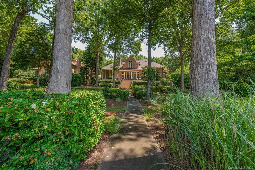 16133 North Point Road Huntersville, NC 28078 - Photo 27 of 42 a front view of a house with a yard