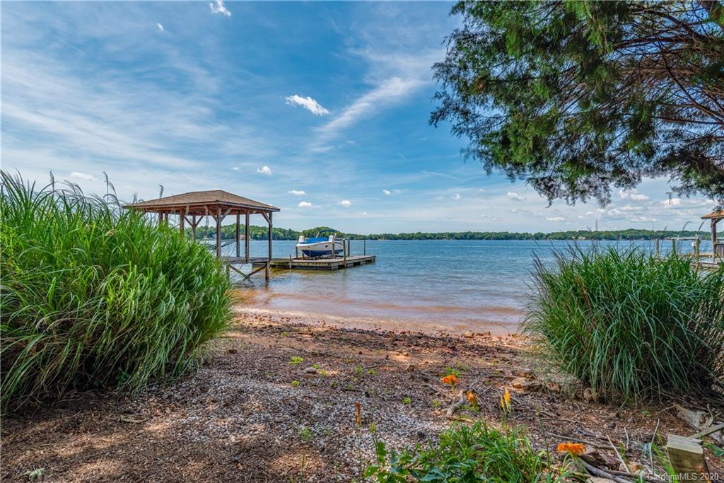 16133 North Point Road Huntersville, NC 28078 - Photo 33 of 42 a view of a lake with a yard