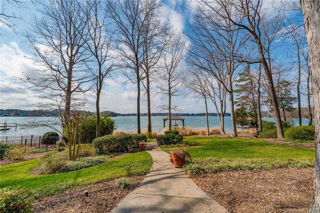 16133 North Point Road Huntersville, NC 28078 - Photo 35 of 42 a front view of a house with garden and trees