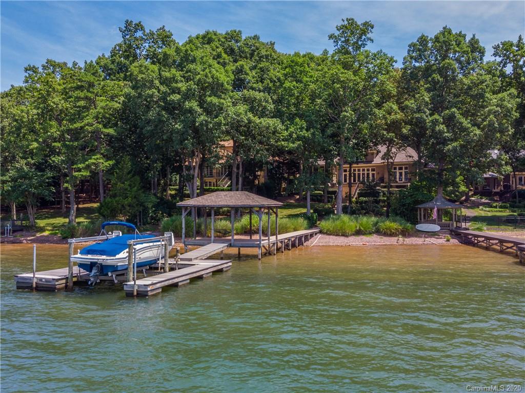 16133 North Point Road Huntersville, NC 28078 - Photo 40 of 42 a view of a swimming pool with lounge chairs in patio