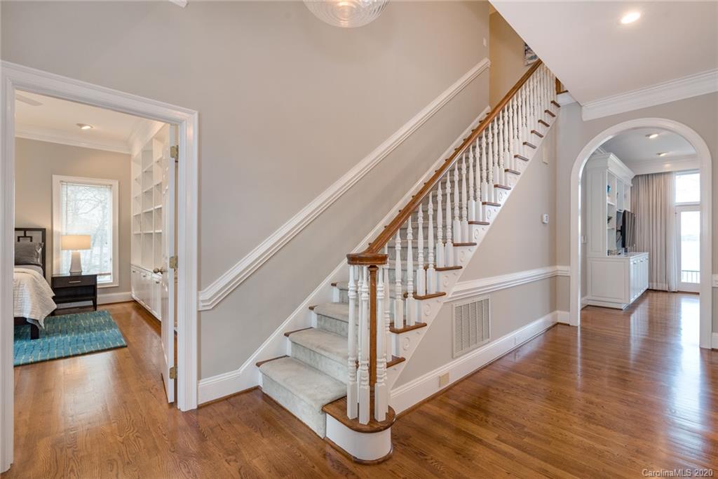 16133 North Point Road Huntersville, NC 28078 - Photo 6 of 42 a view interior of a house with wooden floor windows and a chandelier