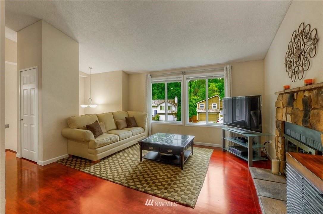 2111 Wells Court South Renton, WA 98055 - Photo 2 of 25 a living room with furniture and a flat screen tv