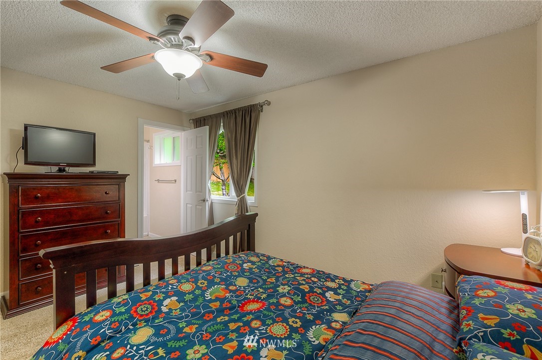 2111 Wells Court South Renton, WA 98055 - Photo 13 of 25 a bedroom with furniture and a baby crib