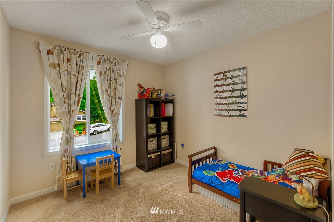 2111 Wells Court South Renton, WA 98055 - Photo 15 of 25 a bedroom with furniture and a window