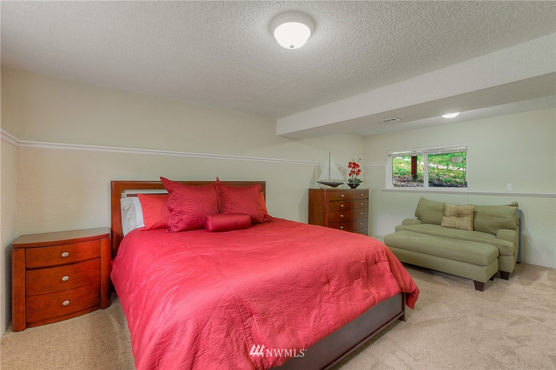 2111 Wells Court South Renton, WA 98055 - Photo 18 of 25 a bedroom with a bed and a couch