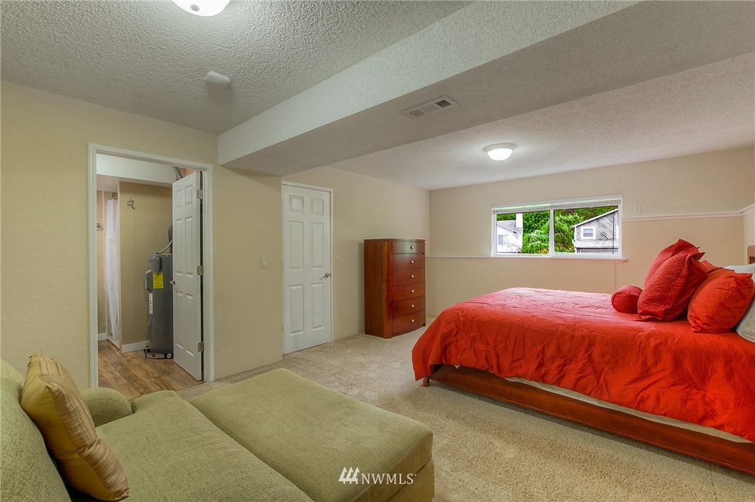 2111 Wells Court South Renton, WA 98055 - Photo 19 of 25 a bedroom with a bed and a window