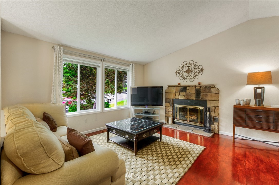 2111 Wells Court South Renton, WA 98055 - Photo 3 of 25 a living room with furniture and a fireplace