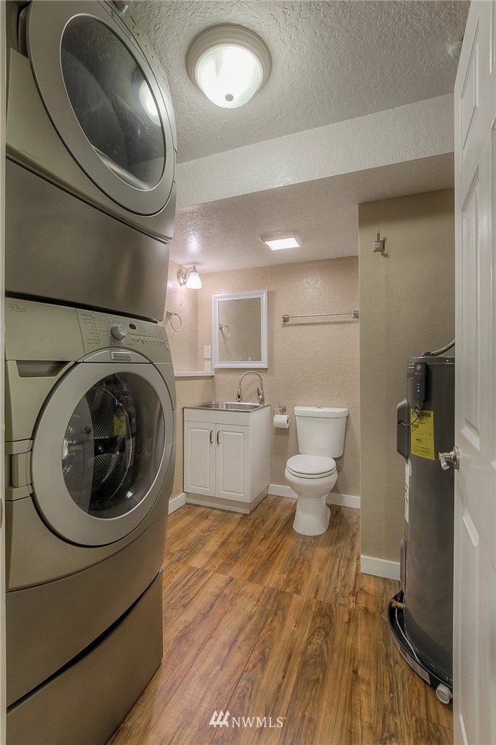 2111 Wells Court South Renton, WA 98055 - Photo 21 of 25 a bathroom with a sink mirror vanity and toilet