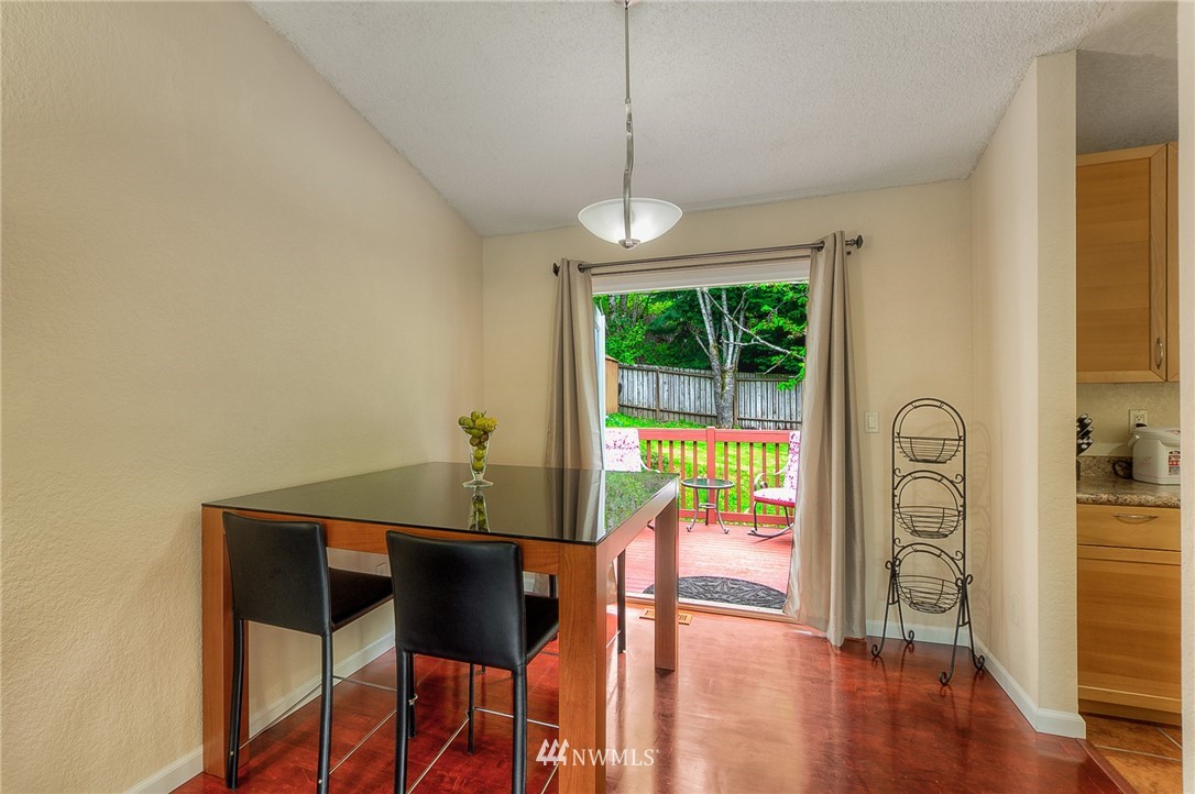 2111 Wells Court South Renton, WA 98055 - Photo 5 of 25 a view of a dining room with furniture window and wooden floor
