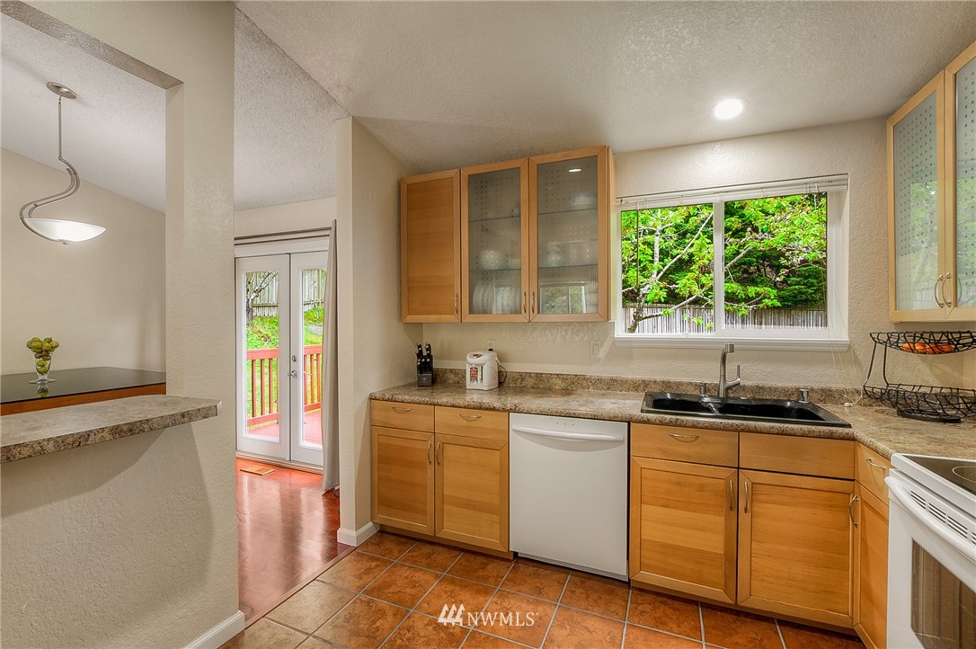 2111 Wells Court South Renton, WA 98055 - Photo 7 of 25 a kitchen with a sink stove and cabinets