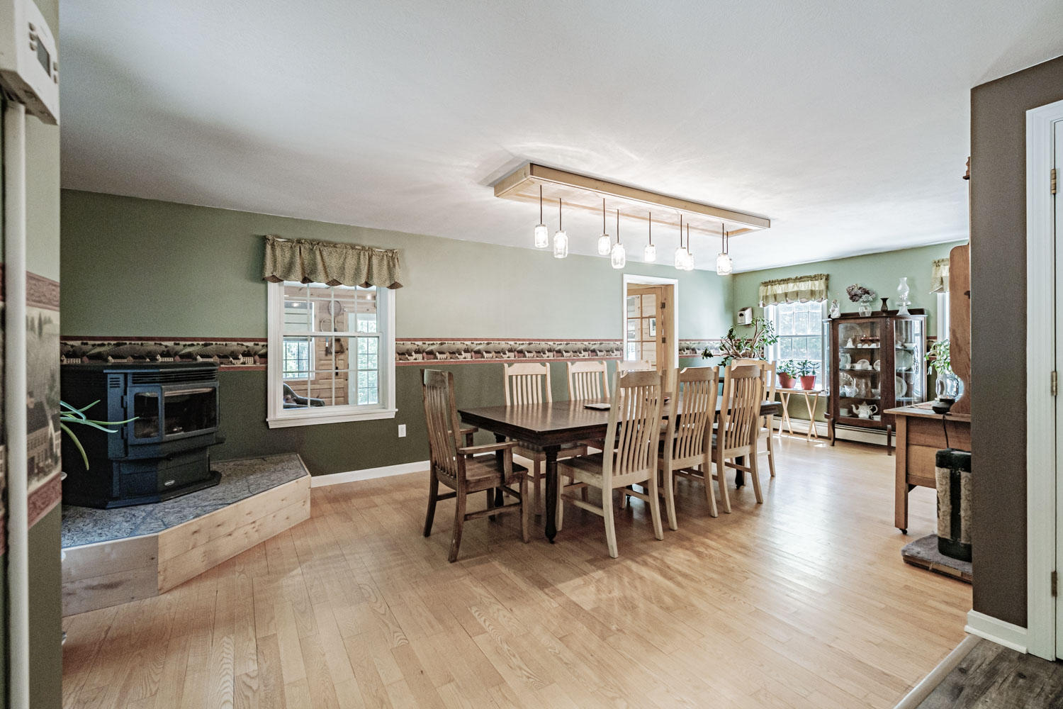 710 Goodwins Mills Road Dayton, ME 04005 - Photo 43 of 97 dinning room with pellet stove