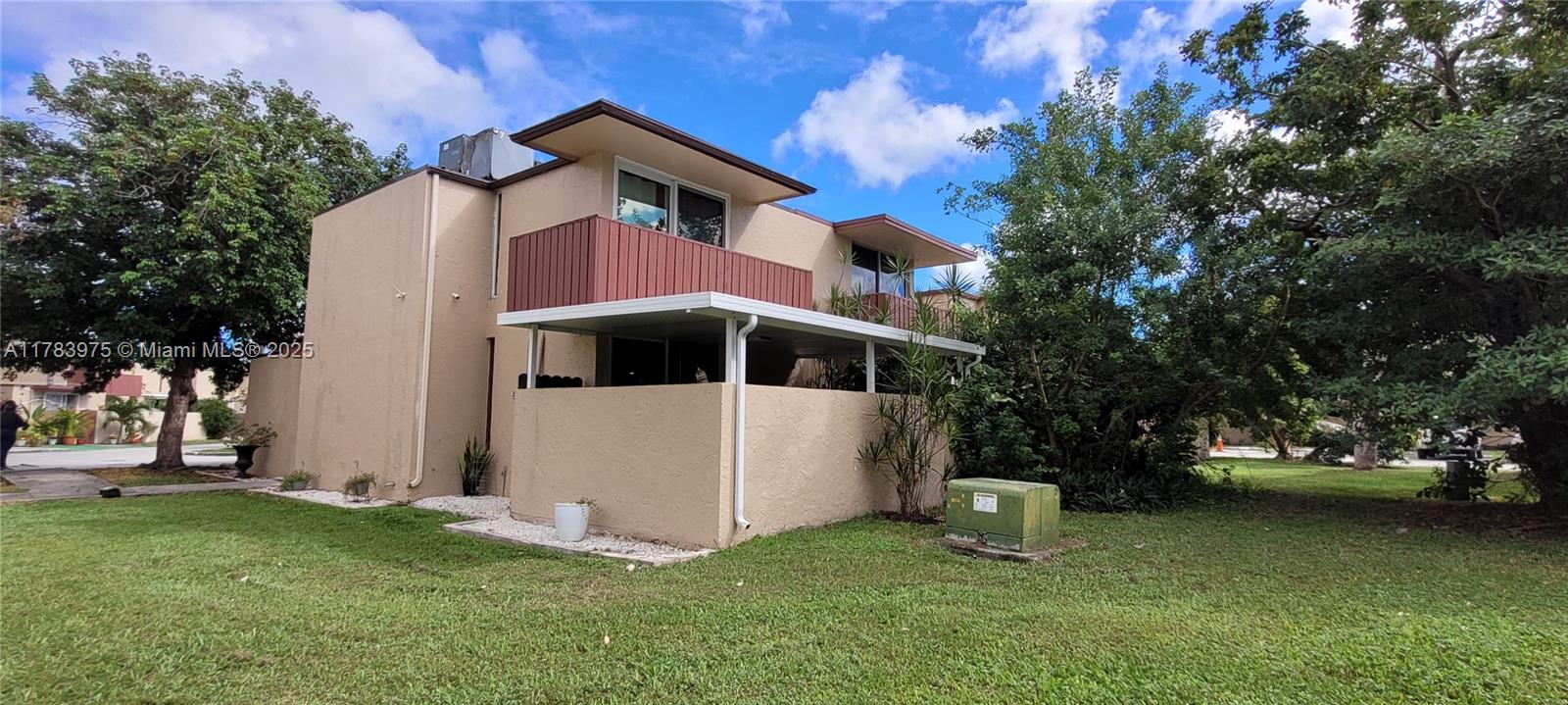 20007 Southwest 123rd Drive Miami, FL 33177 - Photo 1 of 18 a house view with a garden space