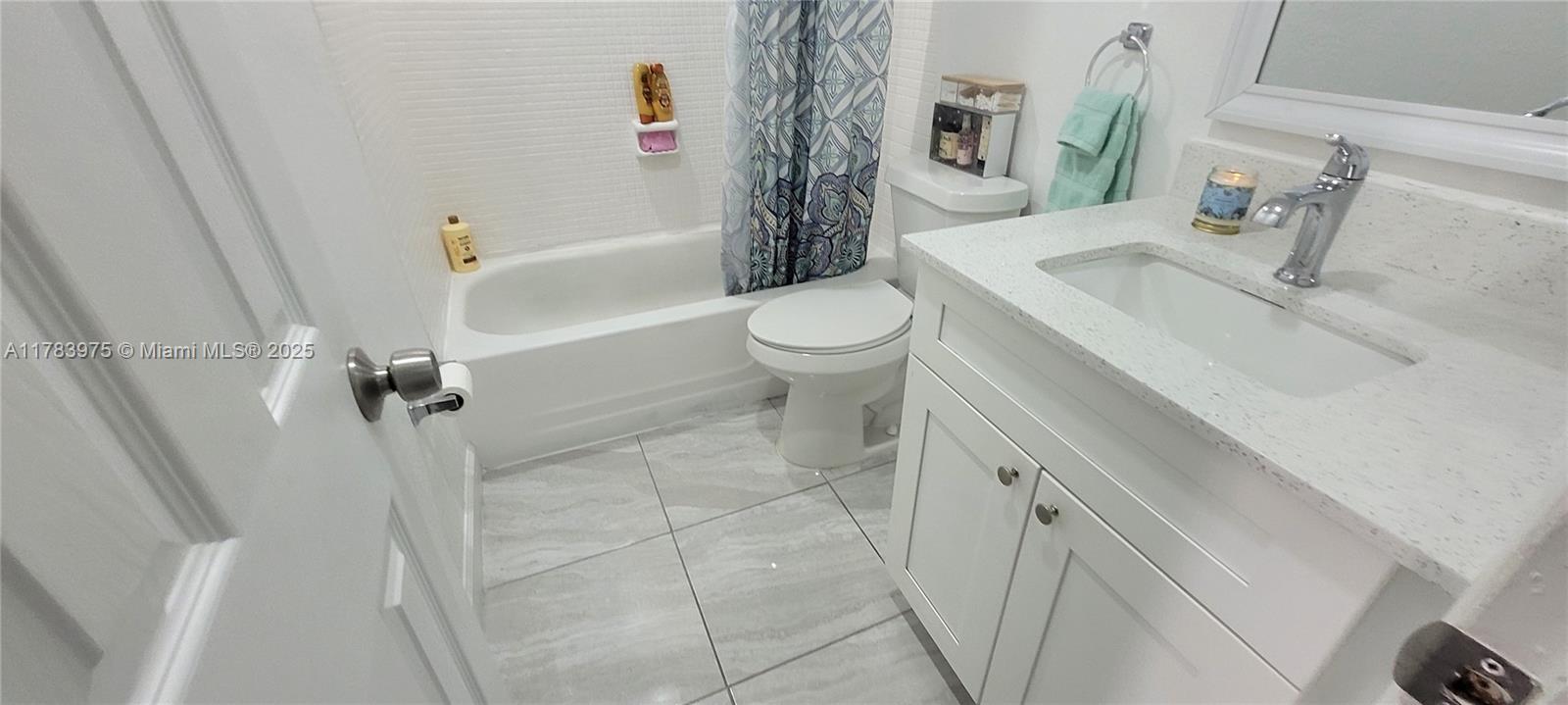 20007 Southwest 123rd Drive Miami, FL 33177 - Photo 11 of 18 a bathroom with a sink a toilet and shower