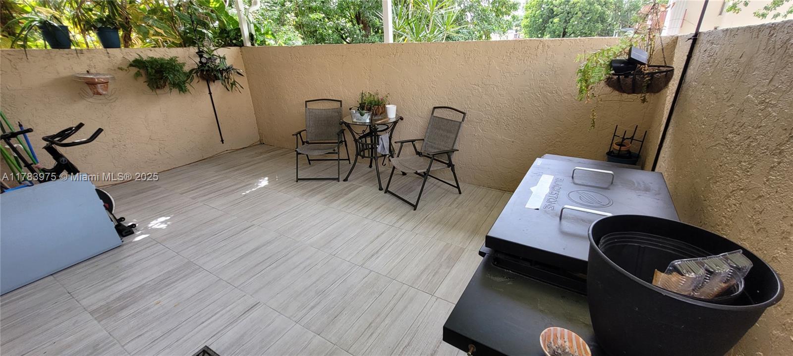 20007 Southwest 123rd Drive Miami, FL 33177 - Photo 12 of 18 a living room with furniture and a potted plant