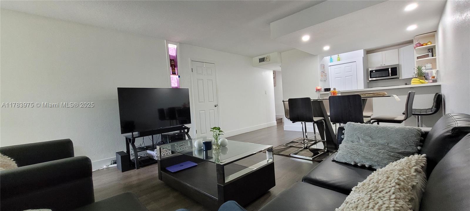 20007 Southwest 123rd Drive Miami, FL 33177 - Photo 6 of 18 a living room with furniture and a flat screen tv