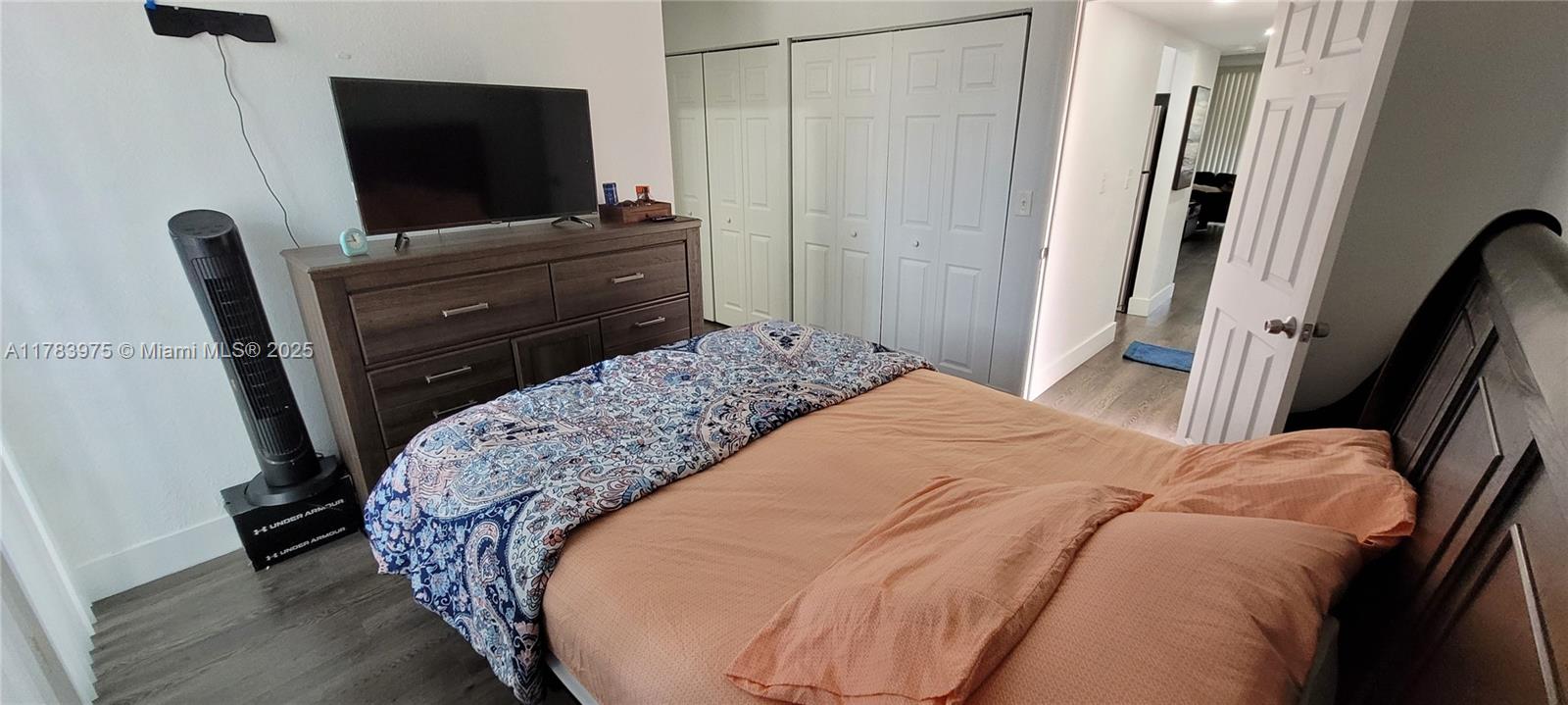 20007 Southwest 123rd Drive Miami, FL 33177 - Photo 9 of 18 a bedroom with a bed and a flat screen tv