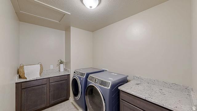 368 East 700 North Springville, UT 84663 - Photo 19 of 55 Laundry room with a textured ceiling, washer and dryer, and cabinet space