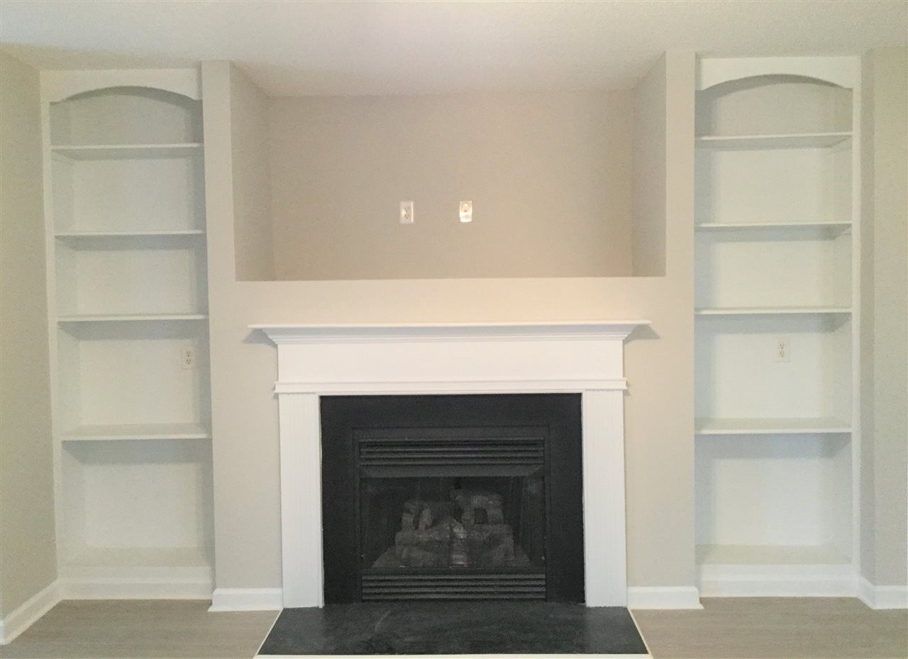 2524 Blackwolf Run Lane Raleigh, NC 27604 - Photo 3 of 18 Gas log fireplace with built in cabinets surrounding. Fireplace