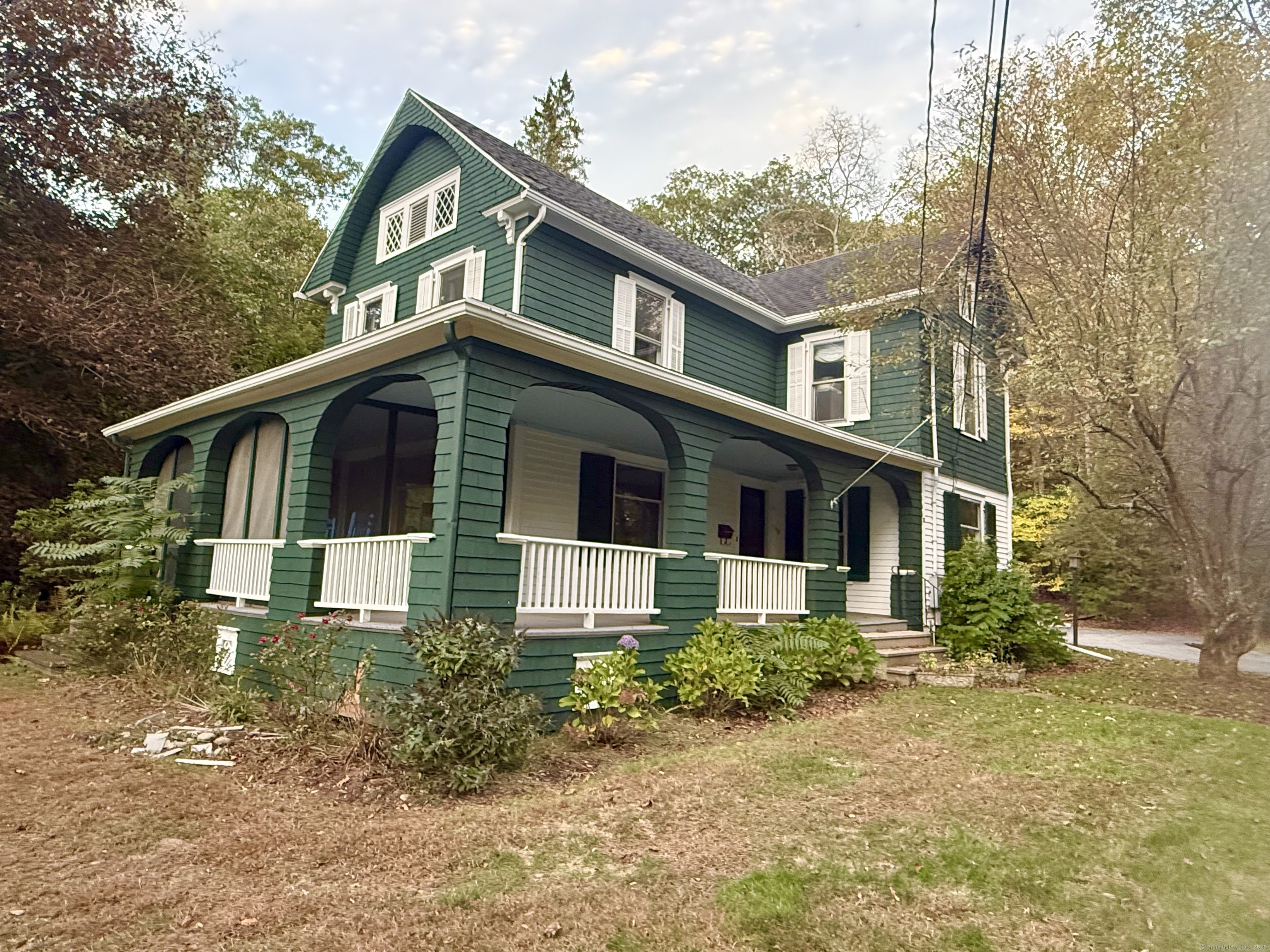 Undisclosed Address Canton, CT 06019 - Photo 2 of 13 a front view of a house with garden