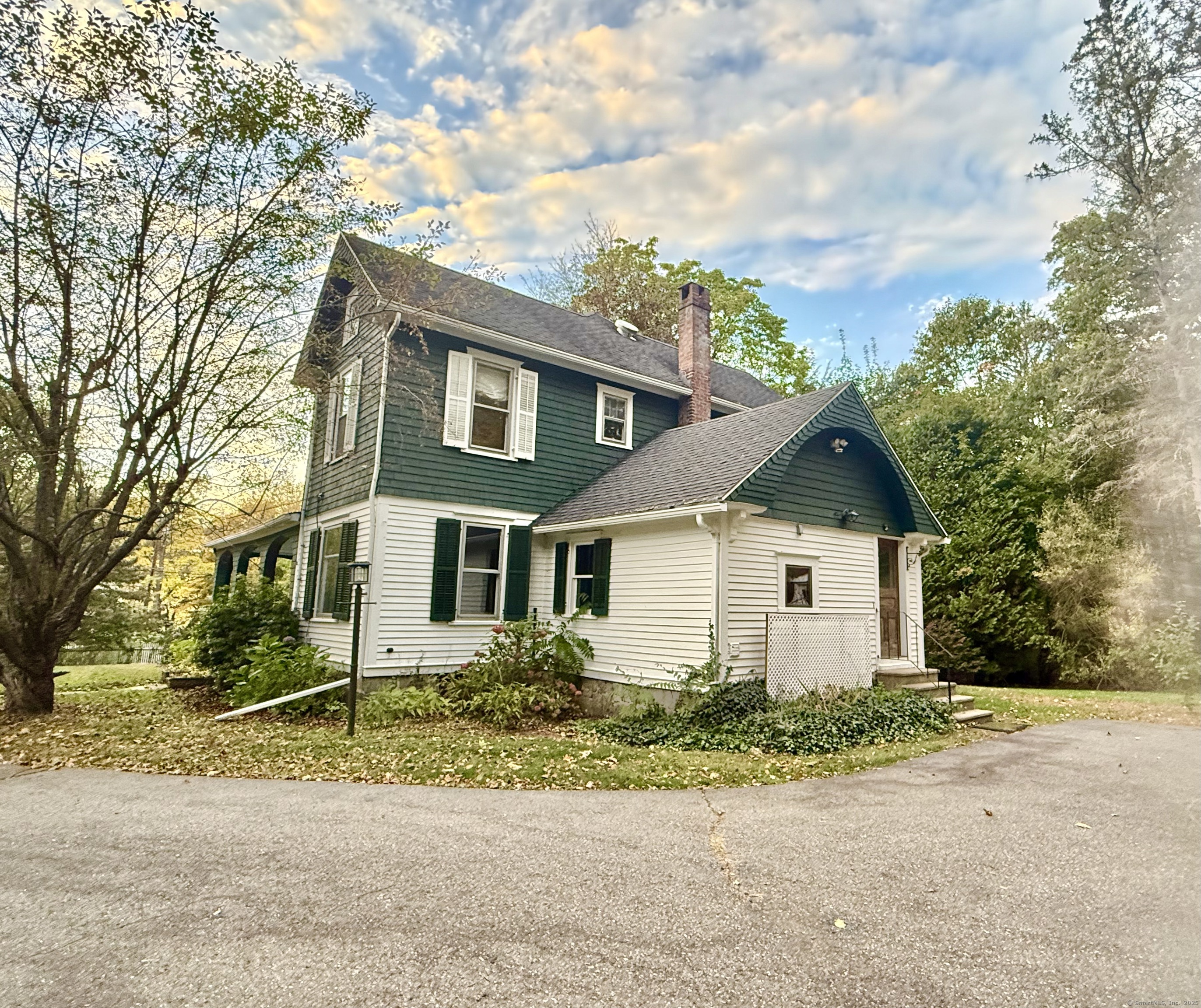 Undisclosed Address Canton, CT 06019 - Photo 3 of 13 front view of a house with a street