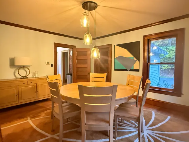 a dining area with furniture and window