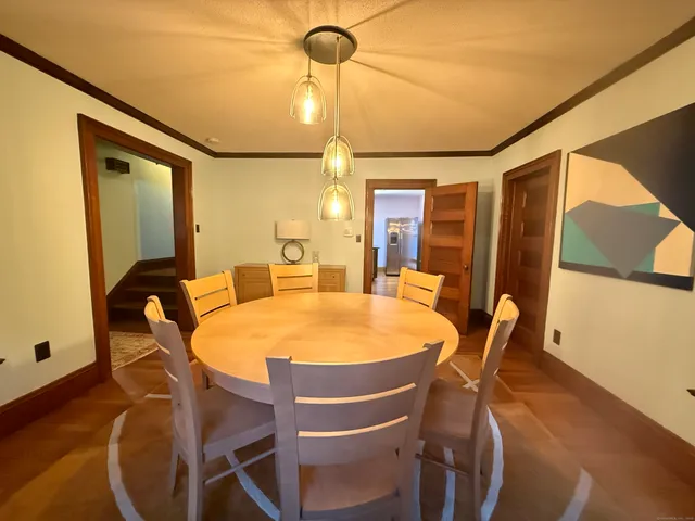 a dining room with furniture and window
