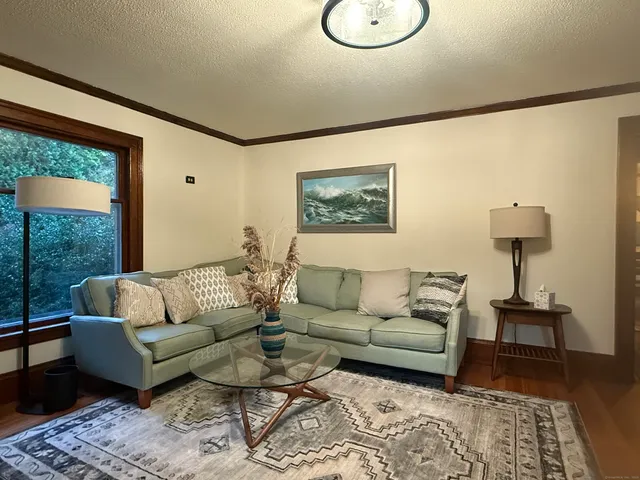 a living room with furniture and a window