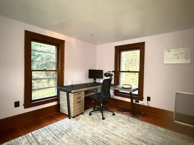 a workspace with furniture and a window