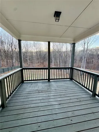 a view of a porch with wooden floor