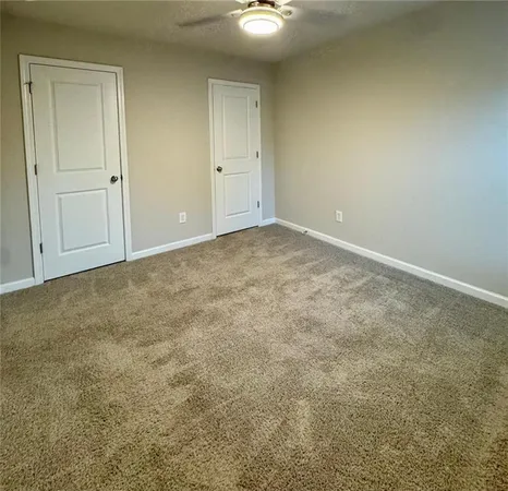 an empty room with a bathroom