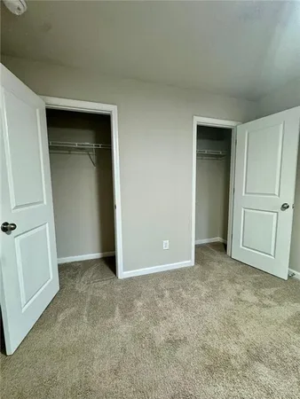 an empty room with closet area