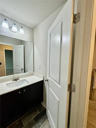 a bathroom with a double vanity sink and mirror