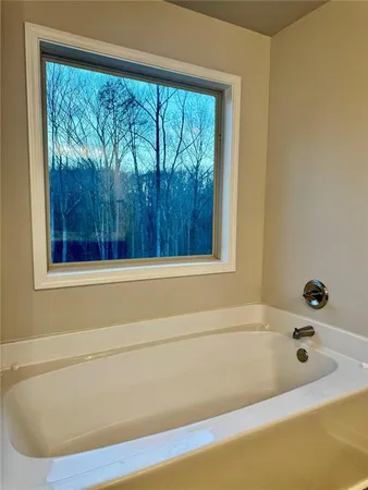 a bathroom with a sink double vanity and a mirror