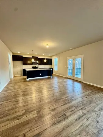 a view of kitchen and wooden floor