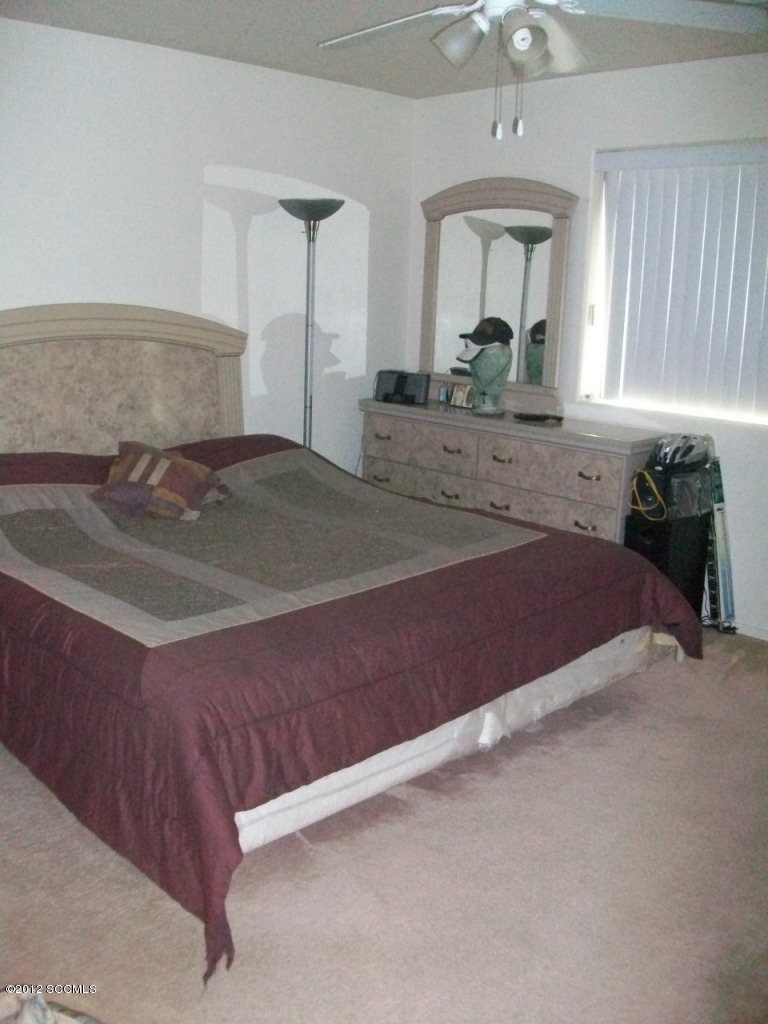 939 Paseo Queretaro Rio Rico, AZ 85648 - Photo 5 of 9 a bedroom with a bed and window