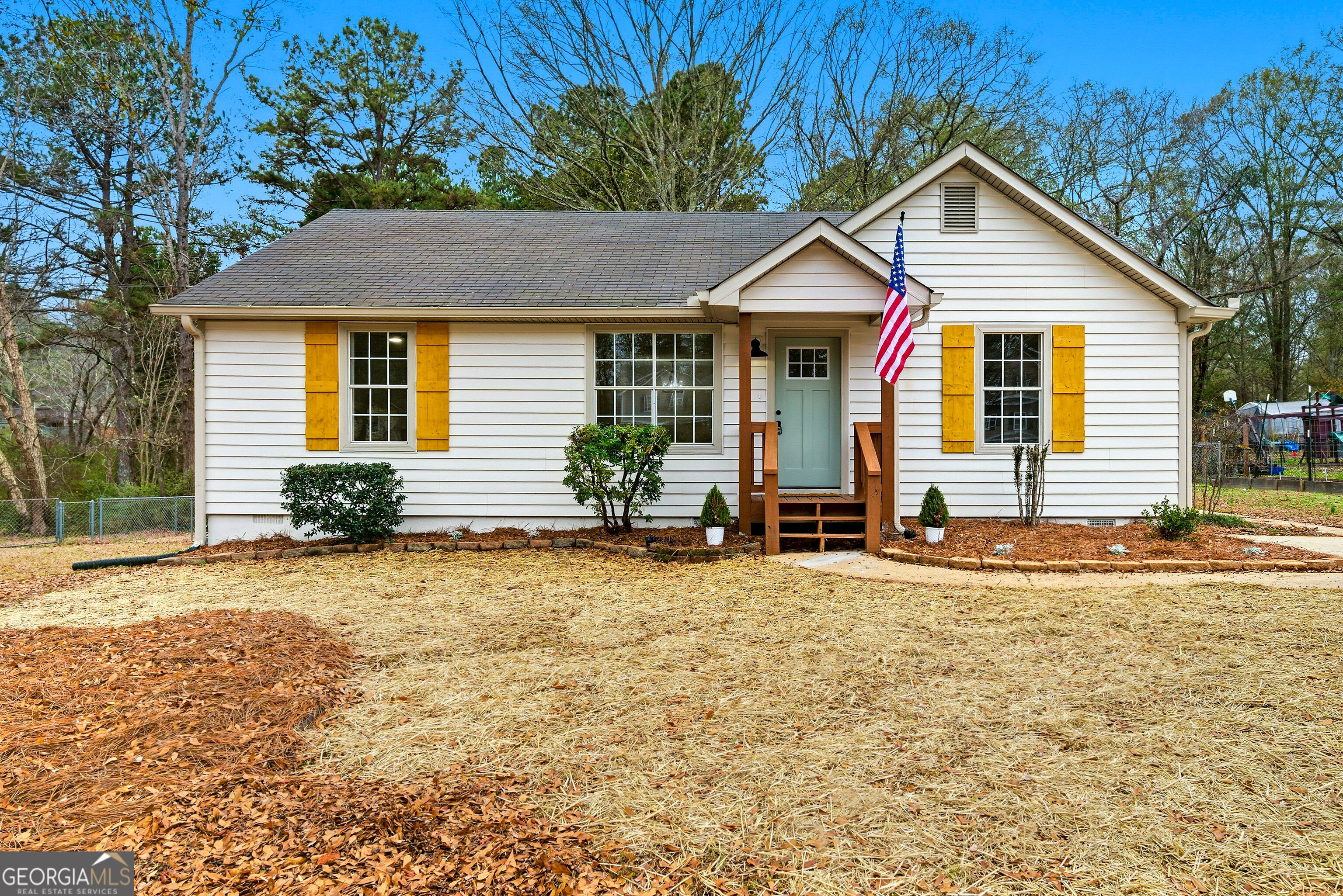 1120 Cohran Store Road Douglasville, GA 30134 - Photo 1 of 1 a view of a house with backyard and sitting area