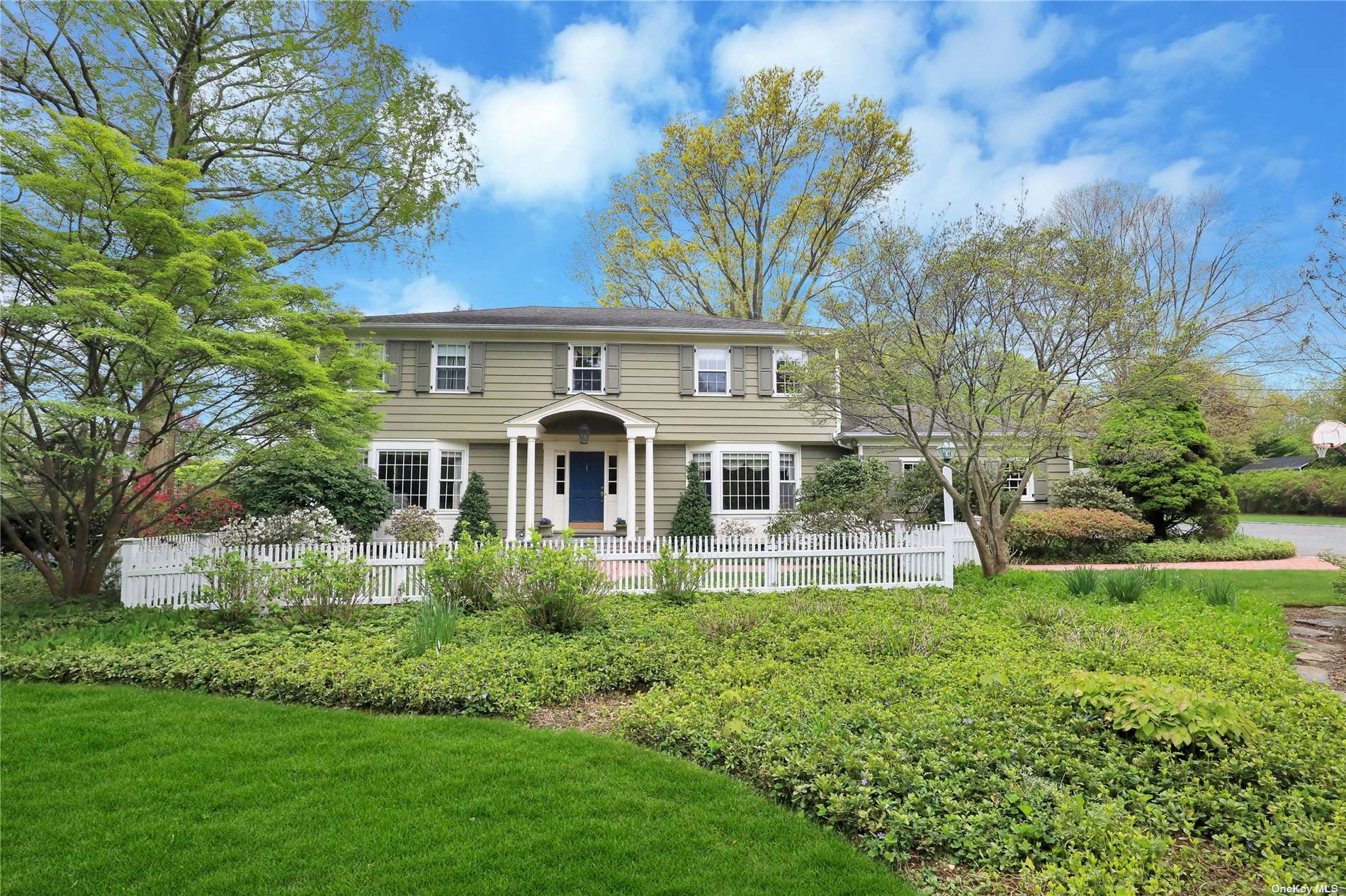 305 Split Rock Road Syosset, NY 11791 - Photo 1 of 1 a front view of a house with a yard