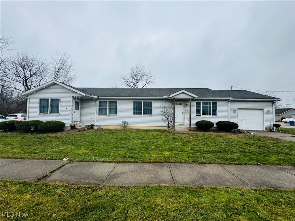 4400 Meister Road Lorain, OH 44053 - Photo 1 of 18 Ranch-style house with a front lawn and a garage