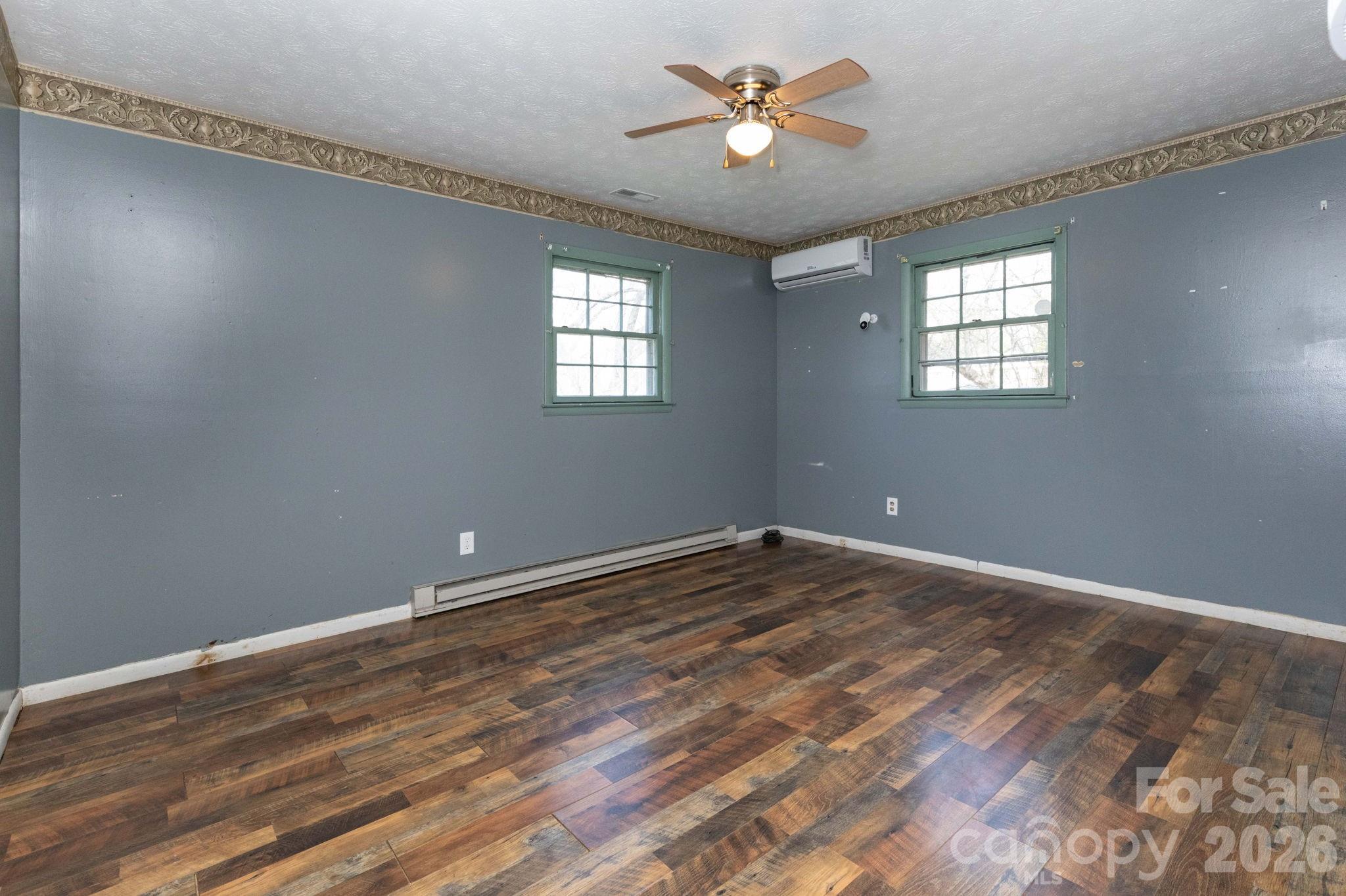 380 Woodland Church Road Clyde, NC 28721 - Photo 11 of 23 a view of empty room with wooden floor